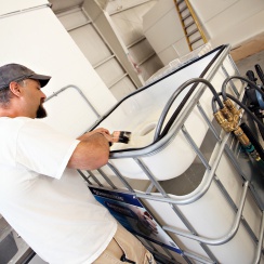 A man using an EnviroWash ES800 paint treatment system