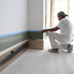 installing masking paper on the baseboard