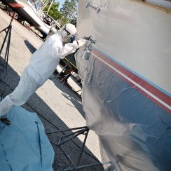 painting a boat in an all purpose coverall