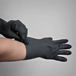 Putting on black rubber gloves