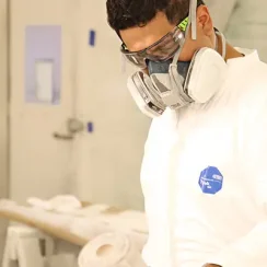 painter wearing e-z clean goggles and respirator mask